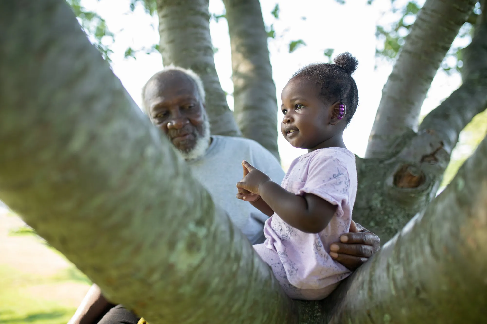 A grandfather and children together outdoors. The multigenerational stakes of health equity.